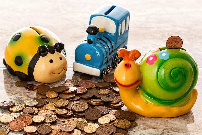 Group of funny piggy banks as a simbol for cheap traffeling